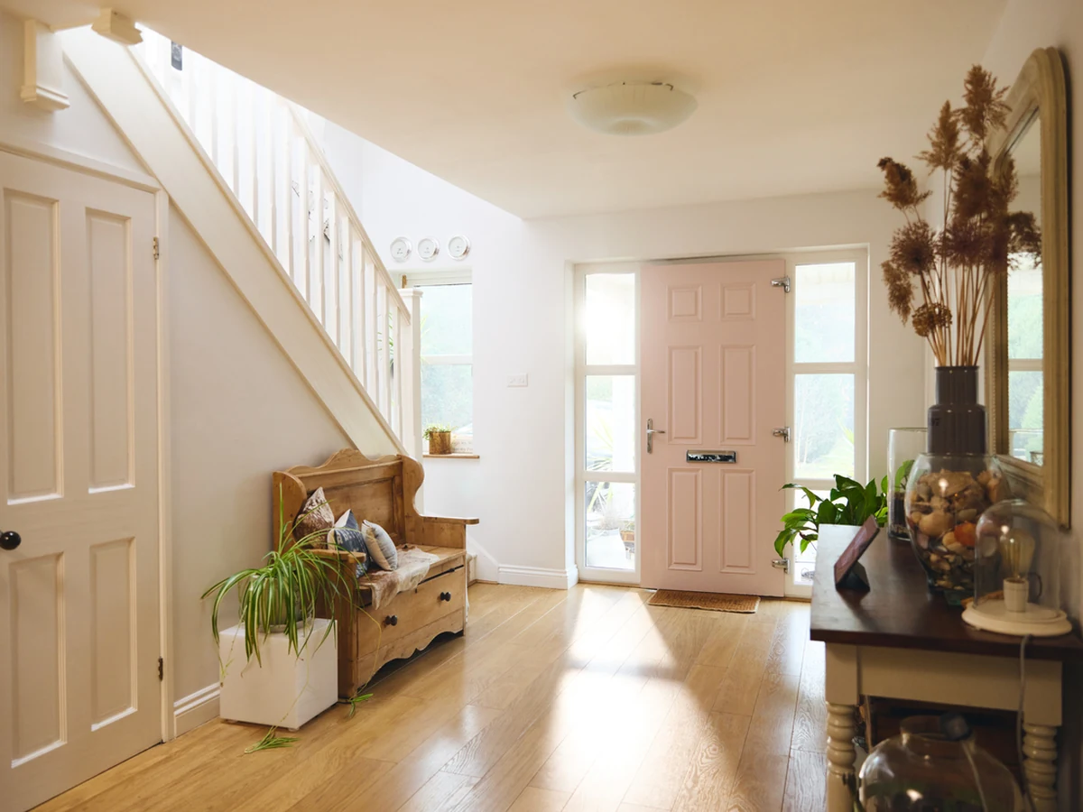 Bright hallway painting with pale finish in Seaton property by Exeter Decorators