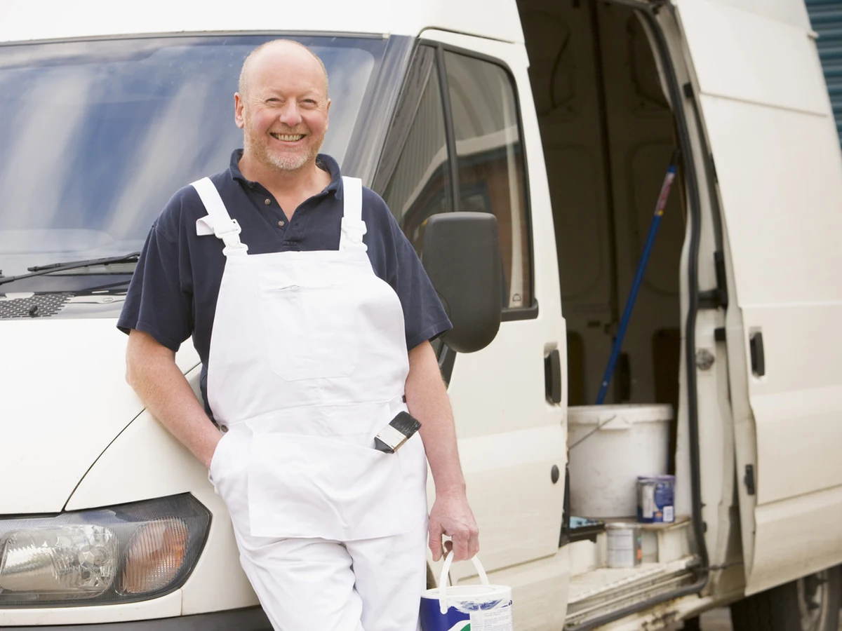 Painters and decorators in Woodbury, Exeter Decorators decorator in overalls ready for work