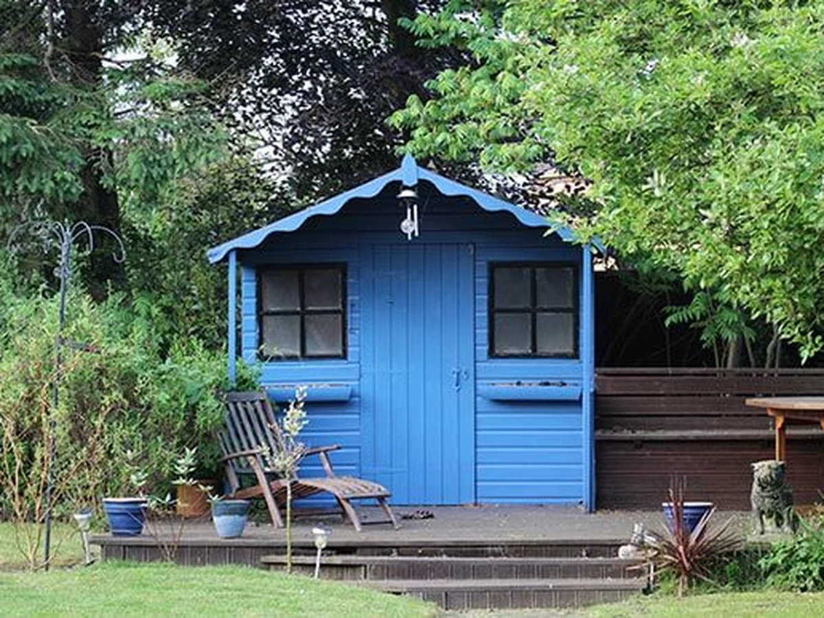 Wood painting in Exeter garden by Exeter Decorators, bright blue finish